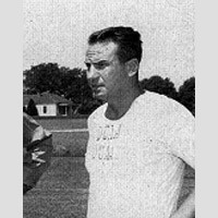 Jack Peach Old photo of a dark-haired man on an athletic field